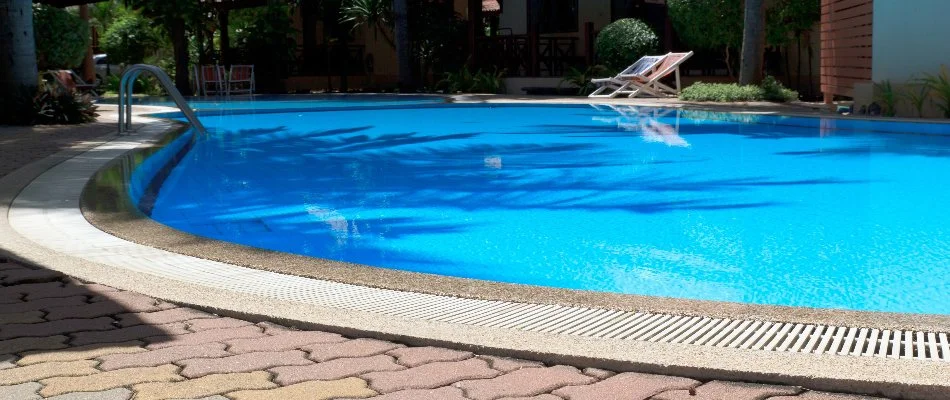Chairs beside a pool in East Quogue, NY.