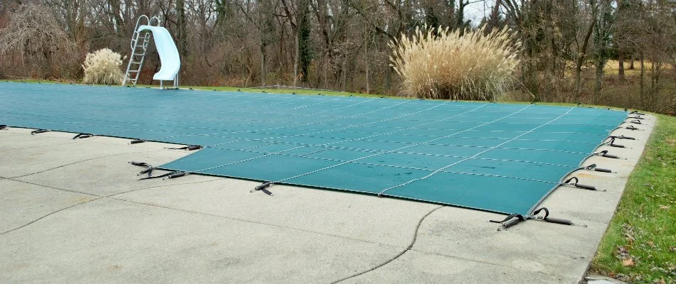 A cover over a pool for the winter.