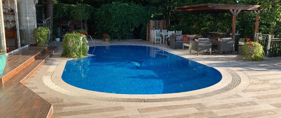 Pool in the backyard of a property in Bridgehampton, NY.