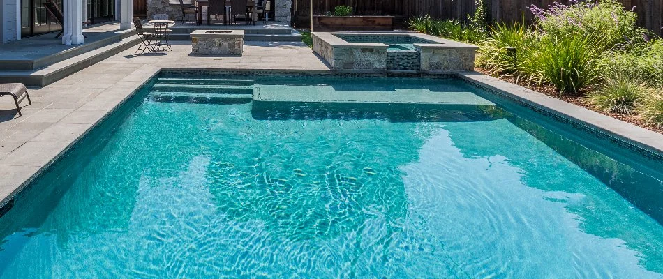 Pool in Southampton, NY, with spa at the back.