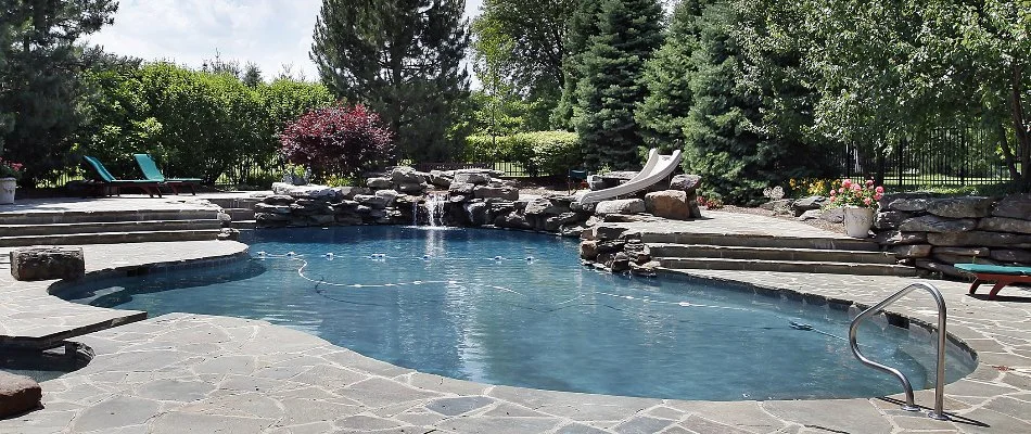 Swimming pool in North Sea, NY, with a water fall and other add-ons.