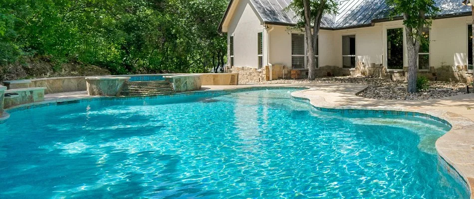 Trees around a pool in Sagaponack, NY.