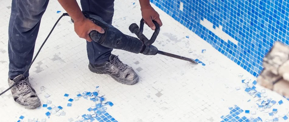 Person renovating a pool in Bridgehampton, NY.