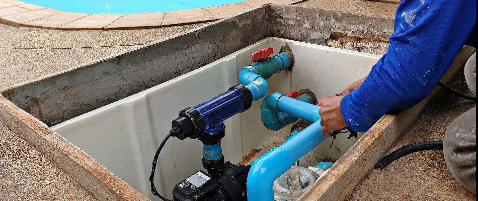 Worker in Bridgehampton, NY, repairing a pool.